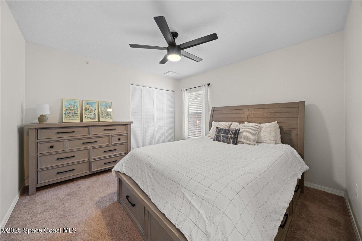 2409 Granger Road Cocoa, FL 32926 - Photo 8 of 36 a bedroom with a bed and a dresser