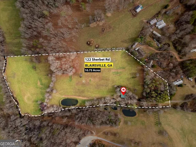 a view of a swimming pool with a yard and mountain view