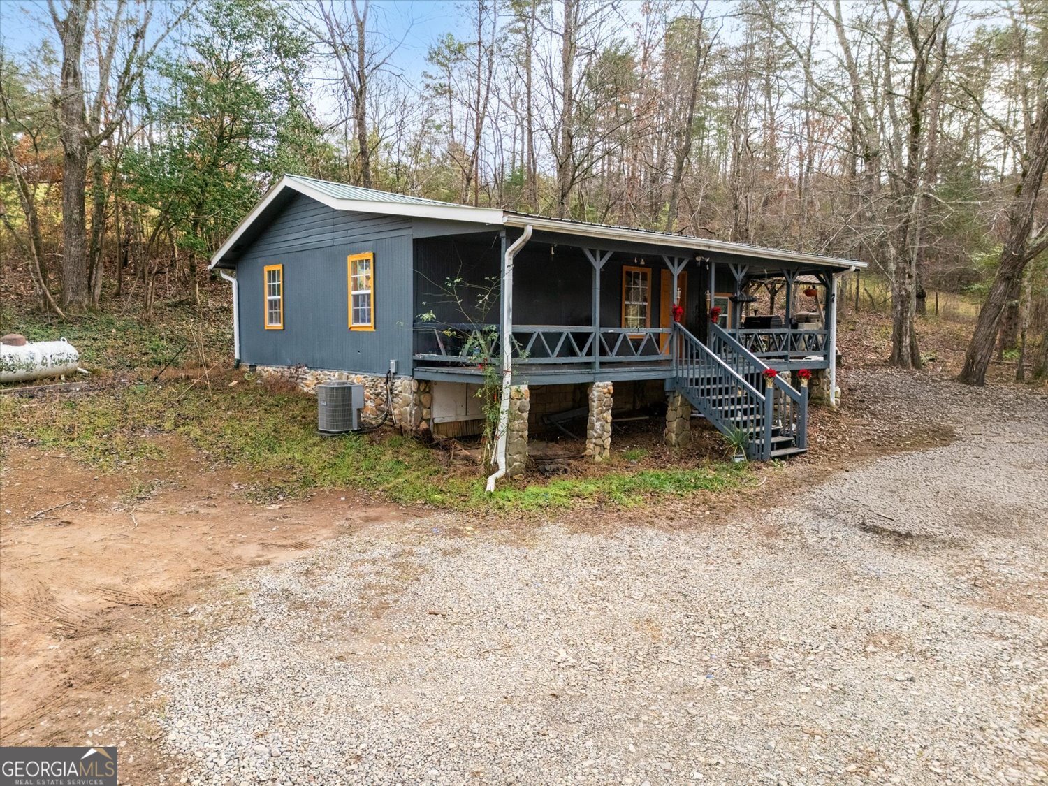 122 Sherbet Road Blairsville, GA 30512 - Photo 2 of 14 a view of a house with a yard and large trees