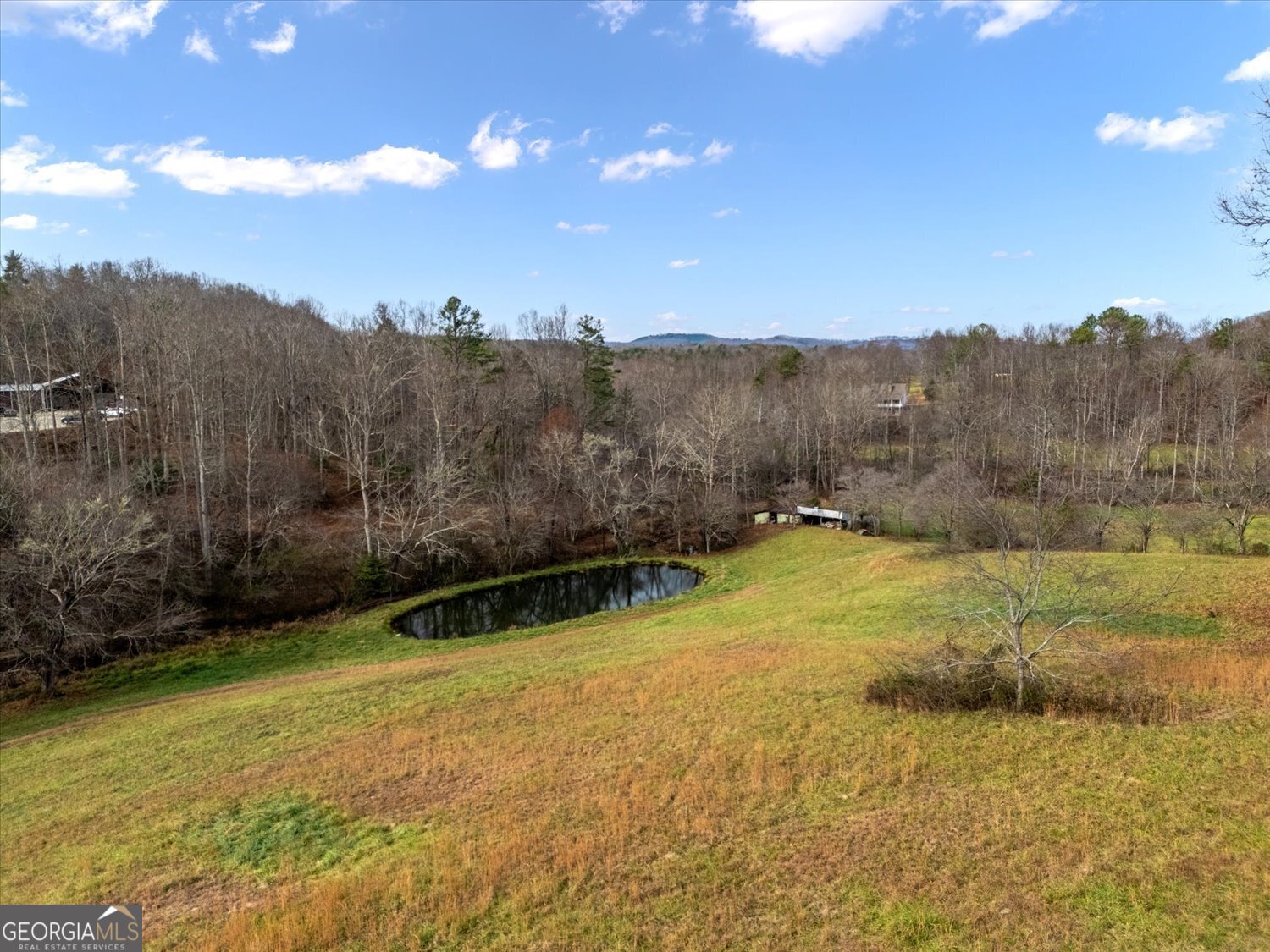 122 Sherbet Road Blairsville, GA 30512 - Photo 7 of 14 a view of a yard with swimming pool and mountains