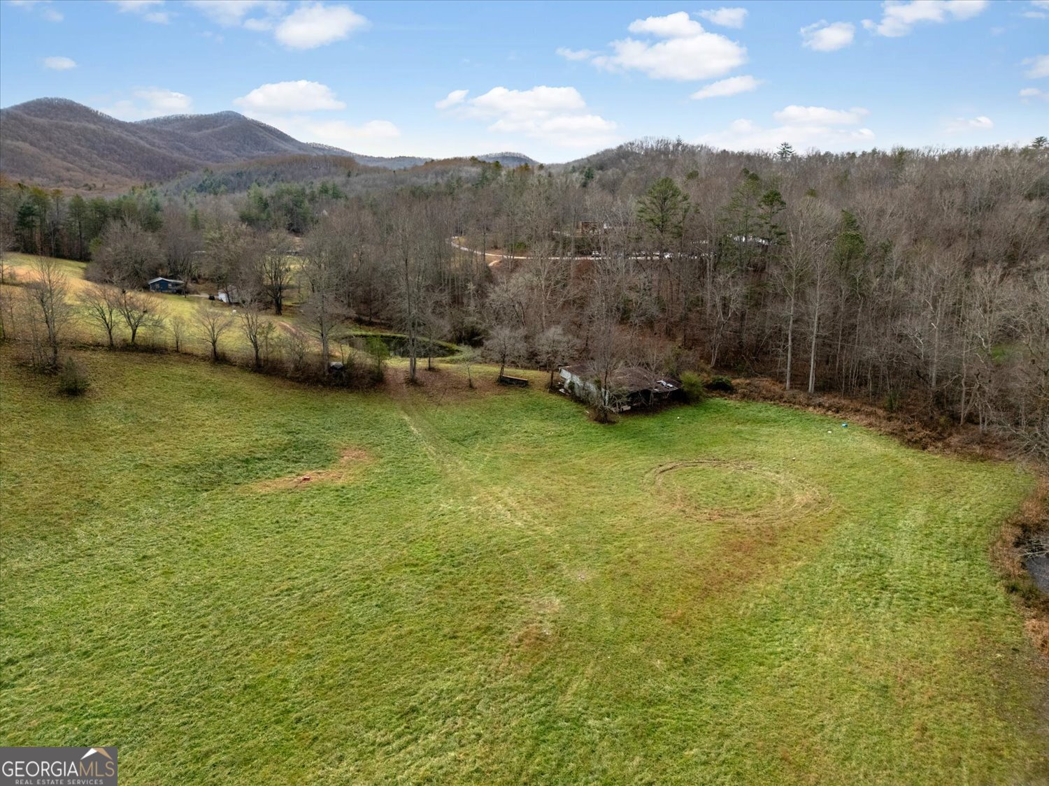 122 Sherbet Road Blairsville, GA 30512 - Photo 9 of 14 a view of a lush green hillside and houses