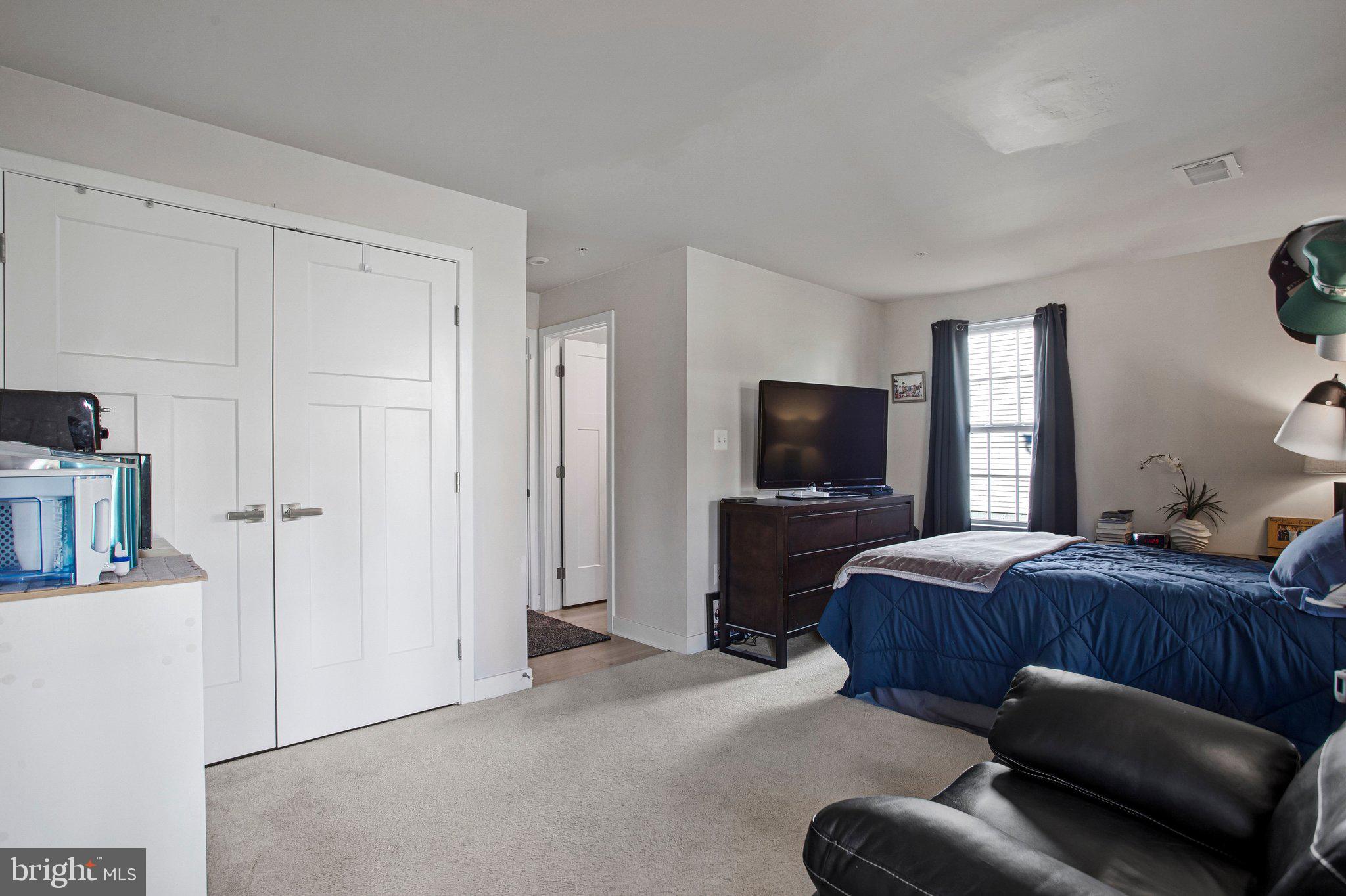 9012 Waller Tree Way Upper Marlboro, MD 20772 - Photo 19 of 29 a bedroom with furniture and a flat screen tv