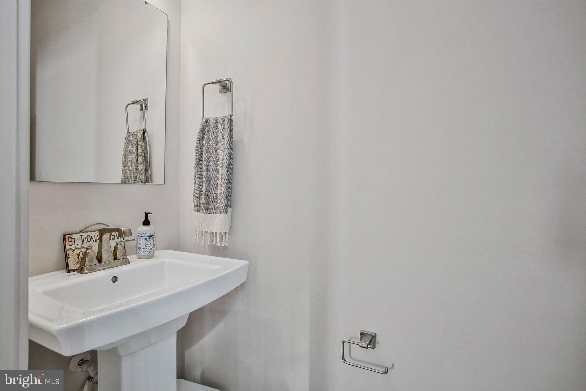 9012 Waller Tree Way Upper Marlboro, MD 20772 - Photo 9 of 29 a bathroom with a sink and a mirror