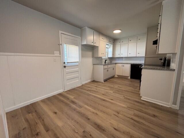 4410 43rd Street Lubbock, TX 79414 - Photo 3 of 9 a kitchen with a refrigerator sink and cabinets