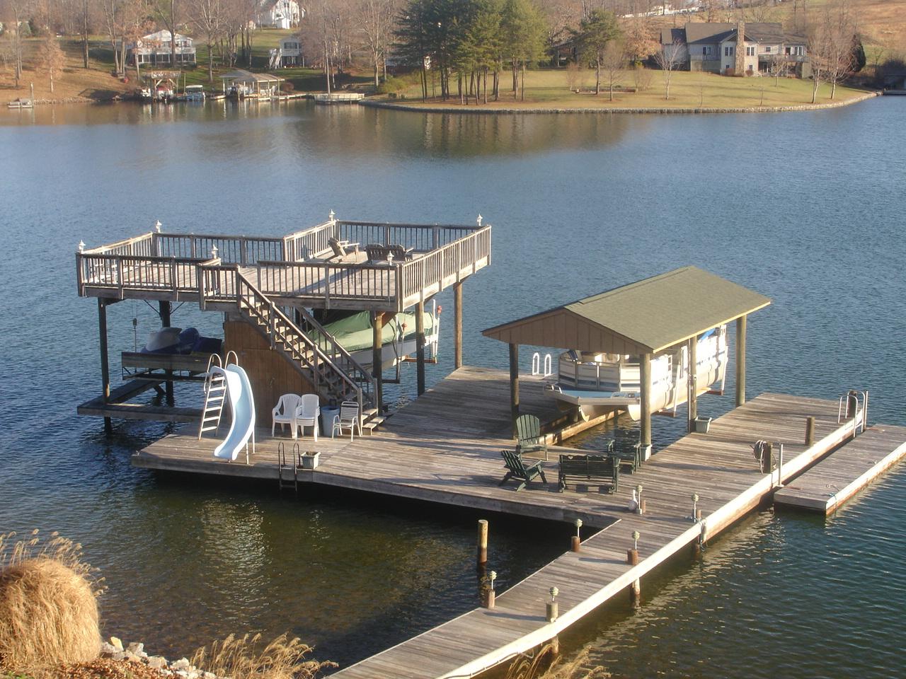 842 Cove Road Penhook, VA 24137 - Photo 2 of 22 a view of a lake with a house