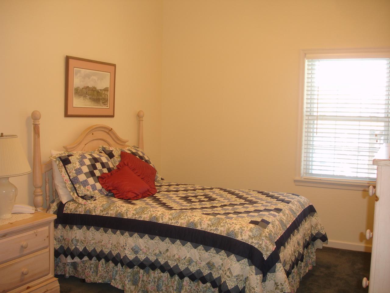 842 Cove Road Penhook, VA 24137 - Photo 13 of 22 a bedroom with a bed and a window