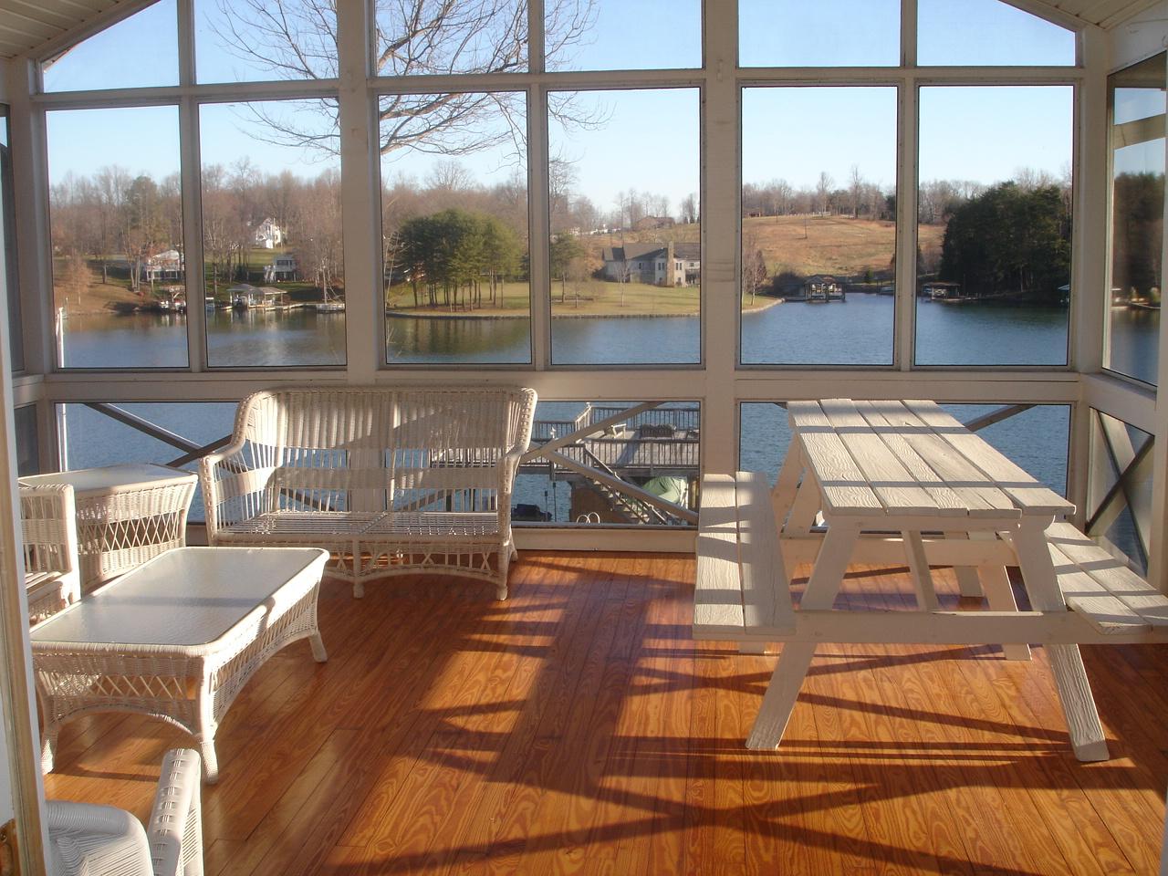 842 Cove Road Penhook, VA 24137 - Photo 15 of 22 a view of a swimming pool with a table and chairs