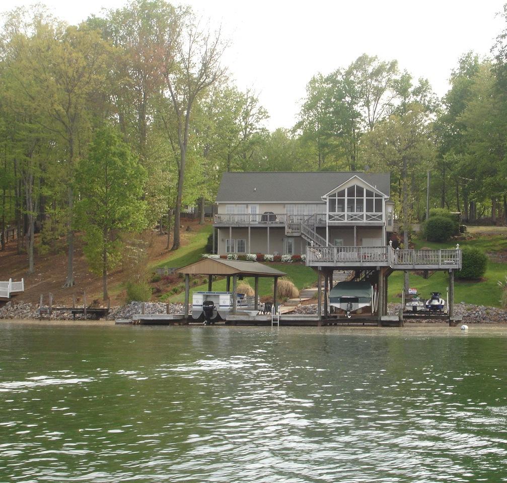 842 Cove Road Penhook, VA 24137 - Photo 20 of 22 a view of a building with river in front of it