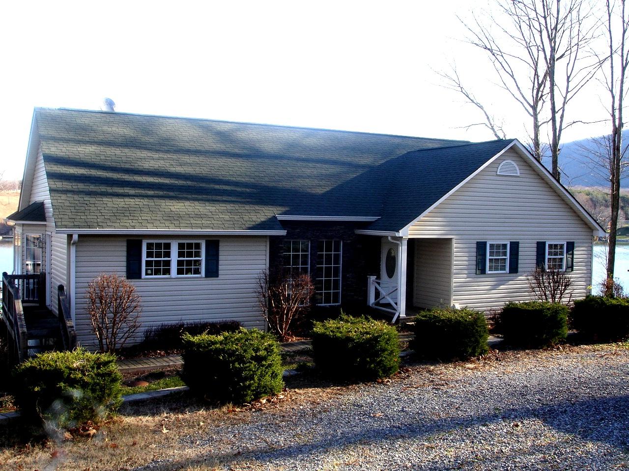 842 Cove Road Penhook, VA 24137 - Photo 3 of 22 a front view of a house with garden
