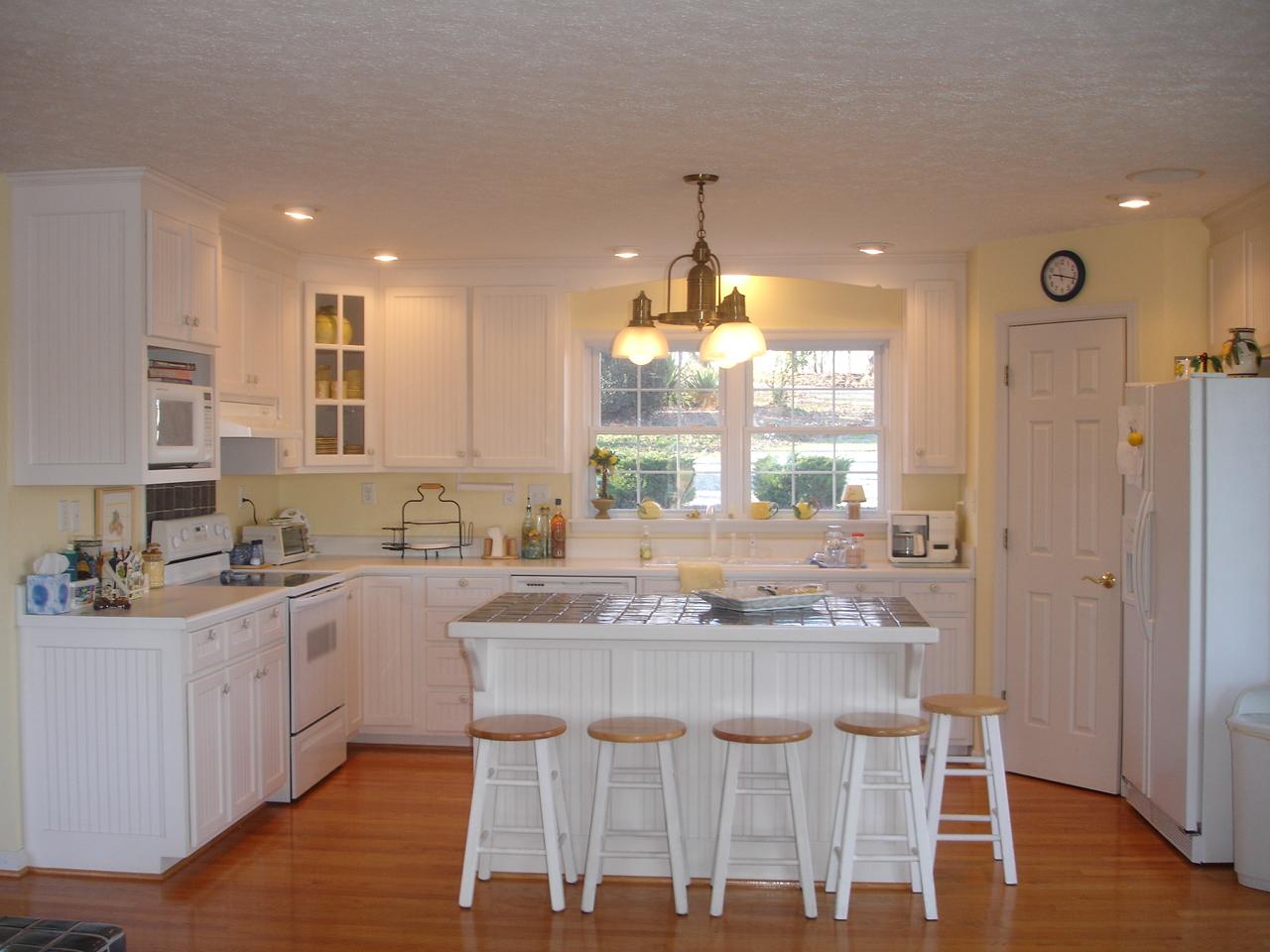 842 Cove Road Penhook, VA 24137 - Photo 4 of 22 a kitchen with kitchen island granite countertop a sink and cabinets