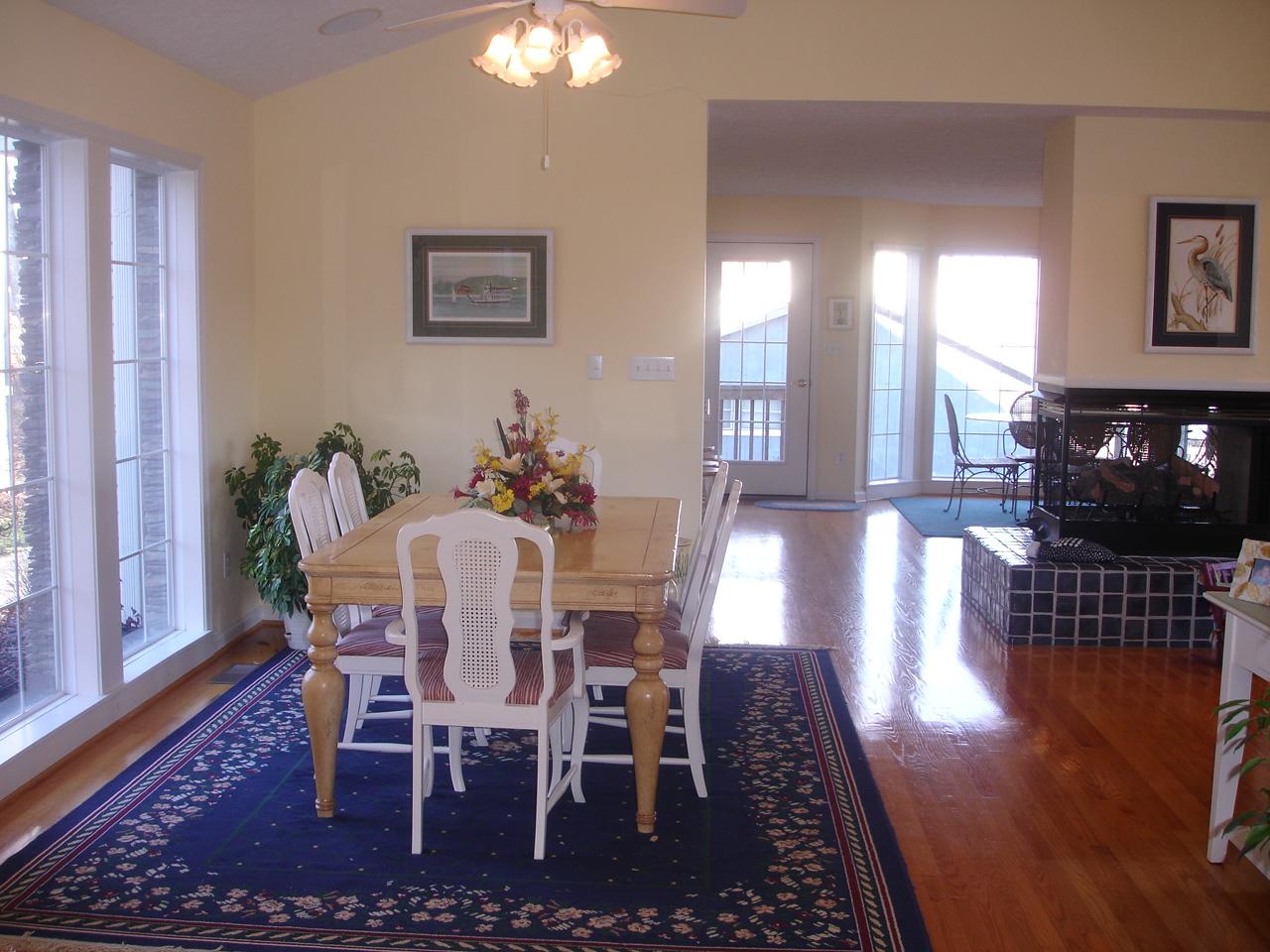 842 Cove Road Penhook, VA 24137 - Photo 7 of 22 a view of a dining room with furniture and wooden floor