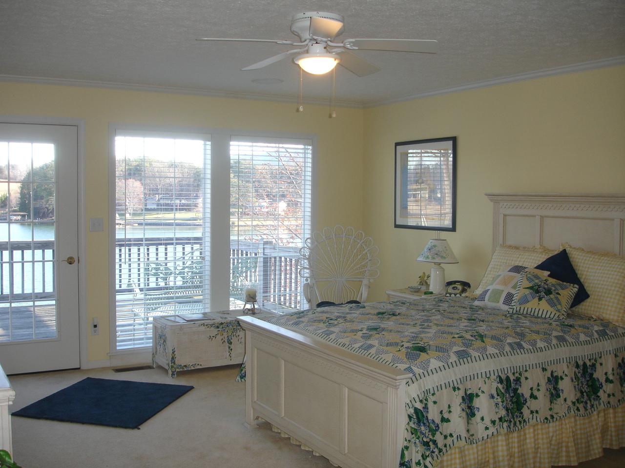 842 Cove Road Penhook, VA 24137 - Photo 10 of 22 a living room with large window and a rug