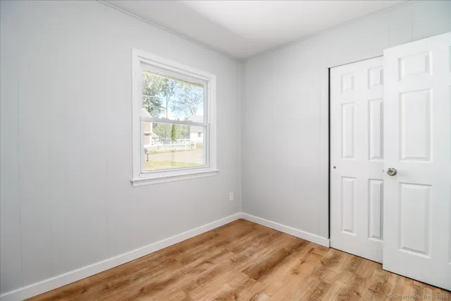 a white toilet sitting next to a bath tub