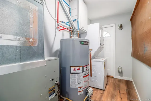 a view of a white house with a small yard