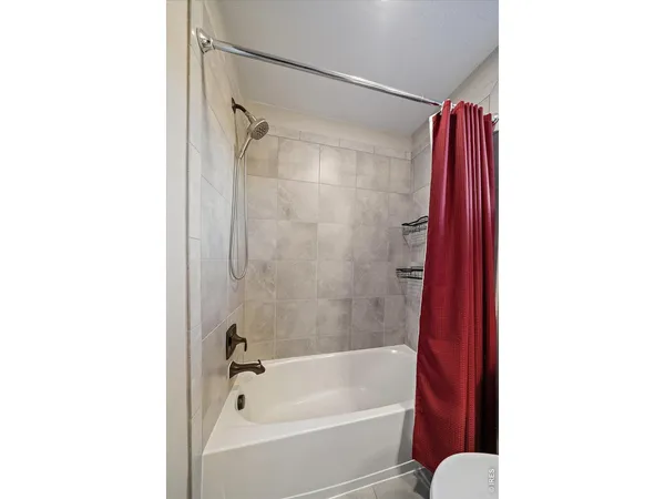 a view of a patio with table and chairs