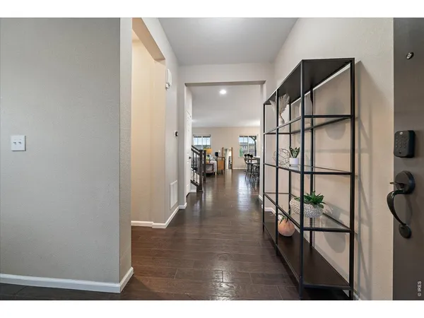 a view of a workspace with furniture and window
