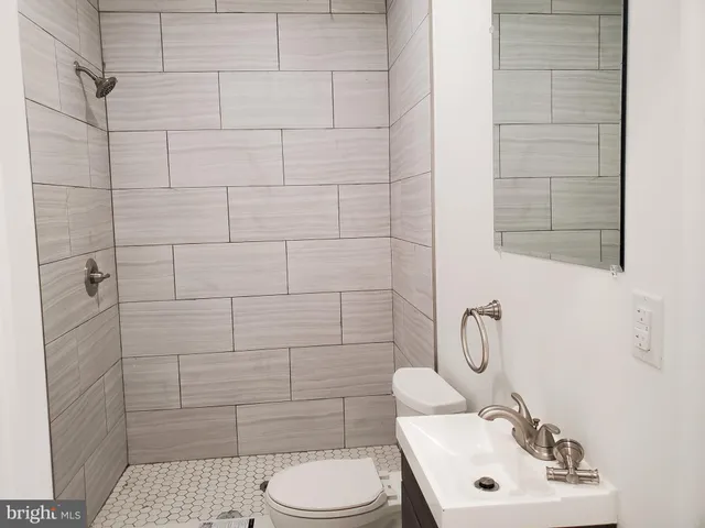 a bathroom with a toilet and a sink