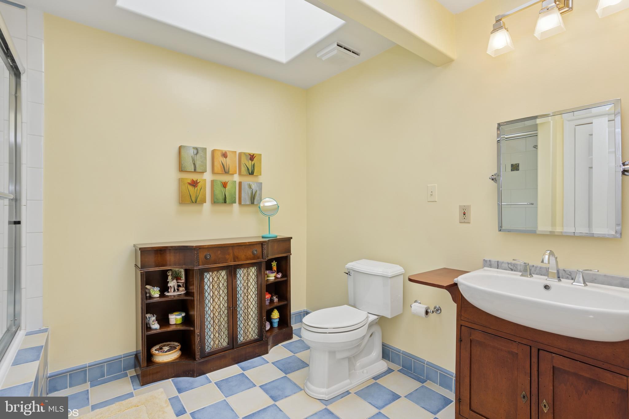 1308 Musgrove Road Lutherville-Timonium, MD 21093 - Photo 39 of 79 a spacious bathroom with a toilet a sink and mirror