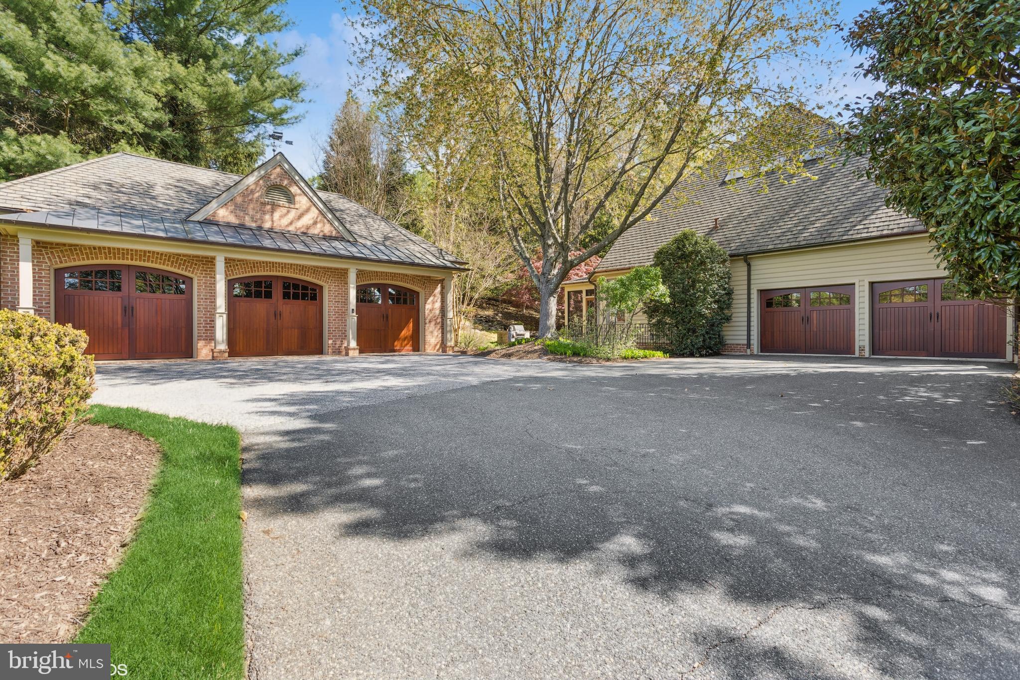 1308 Musgrove Road Lutherville-Timonium, MD 21093 - Photo 5 of 79 a front view of a house with a yard and trees
