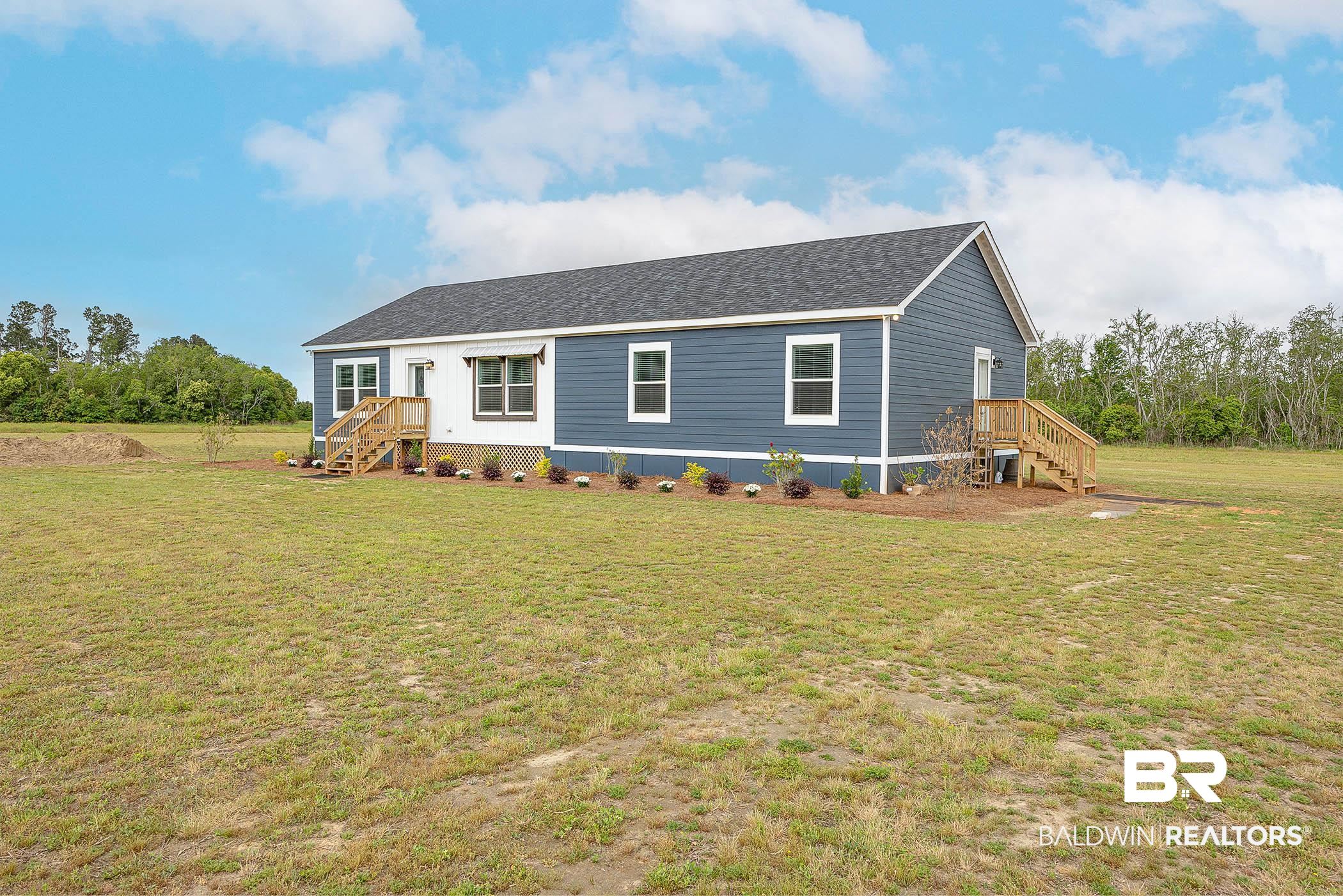 16000 John Bauer Road Summerdale, AL 36580 - Photo 5 of 34 Manufactured / mobile home with a front lawn and a shingled roof