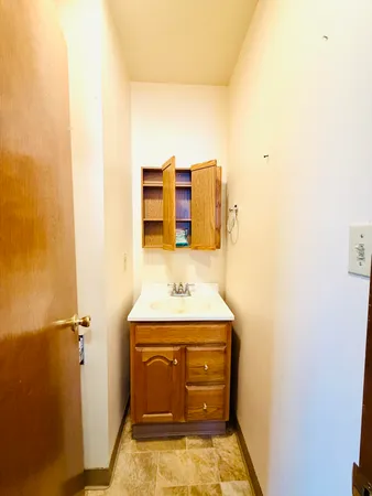 a bathroom with a sink and a mirror