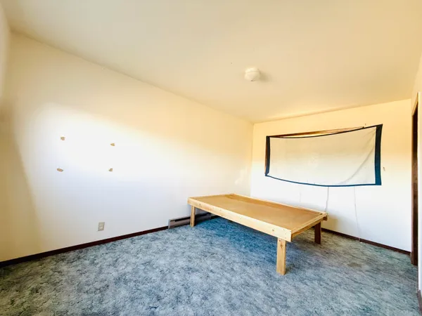 a bench sitting in middle of ceiling room
