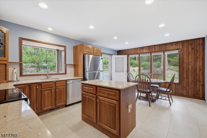 9 Henderson Hill Road Hampton, NJ 08827 - Photo 11 of 36 a kitchen with stainless steel appliances granite countertop sink stove and table