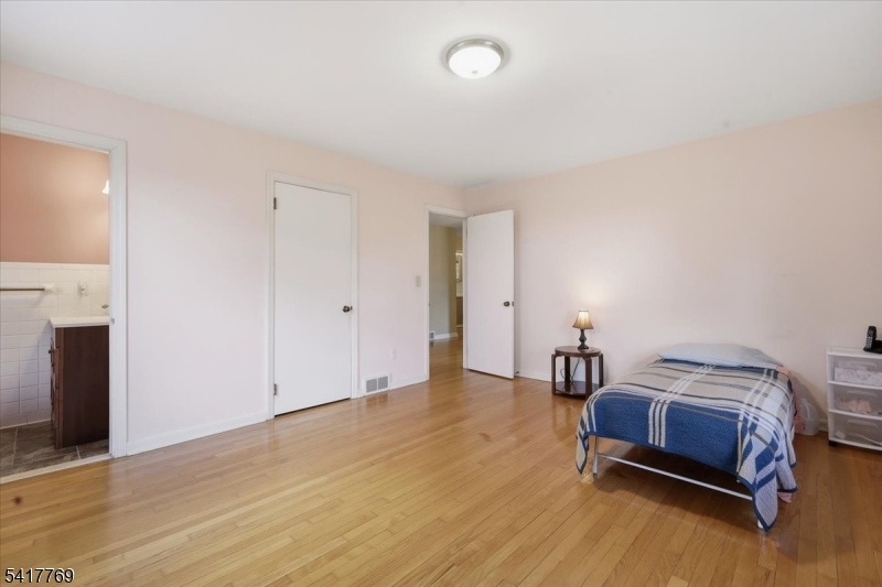 9 Henderson Hill Road Hampton, NJ 08827 - Photo 16 of 36 a bedroom with a bed and a fireplace