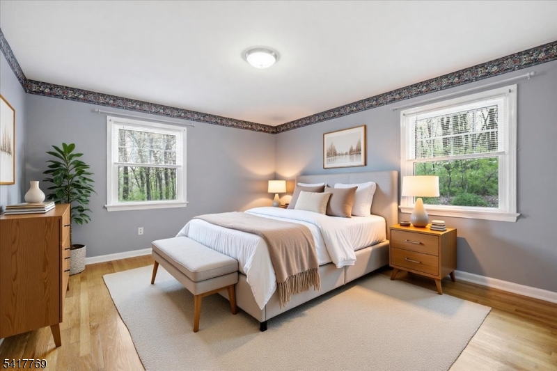 9 Henderson Hill Road Hampton, NJ 08827 - Photo 18 of 36 a bedroom with a bed and wooden floor