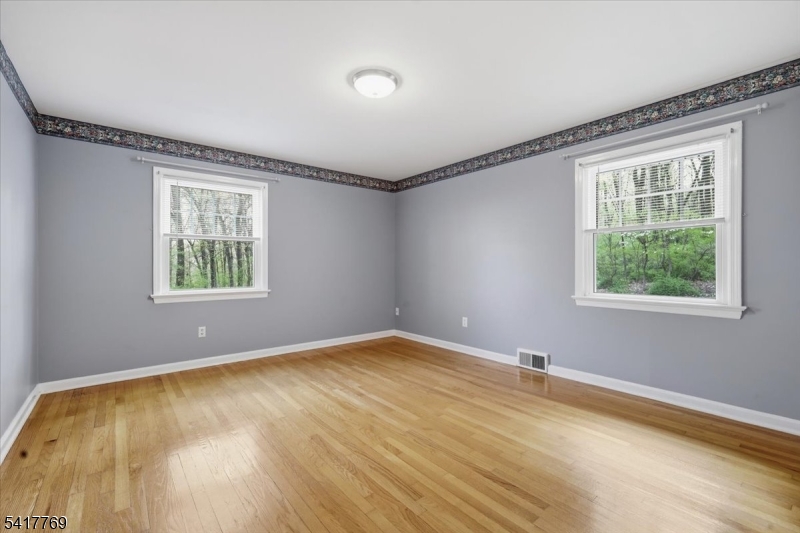 9 Henderson Hill Road Hampton, NJ 08827 - Photo 19 of 36 a view of an empty room with wooden floor and a window