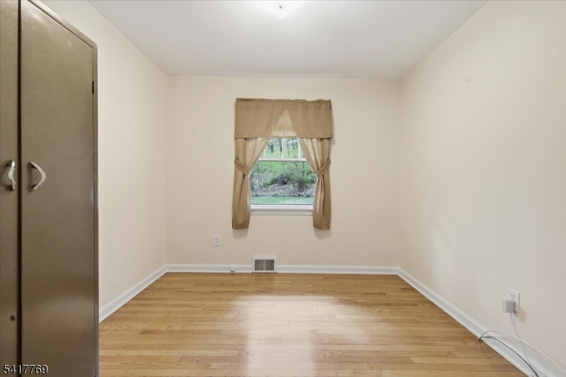 9 Henderson Hill Road Hampton, NJ 08827 - Photo 22 of 36 a view of an empty room with wooden floor and a window