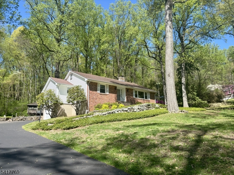 9 Henderson Hill Road Hampton, NJ 08827 - Photo 32 of 36 a front view of a house with a garden
