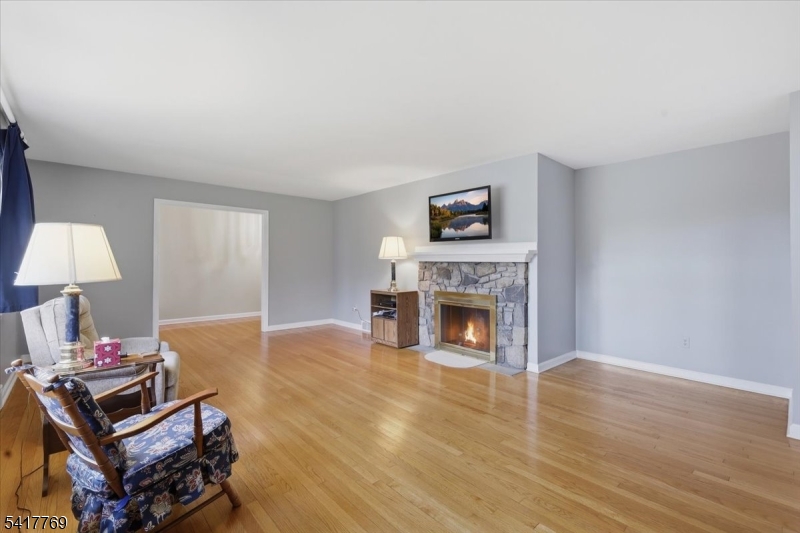 9 Henderson Hill Road Hampton, NJ 08827 - Photo 6 of 36 a living room with furniture a fireplace and a flat screen tv