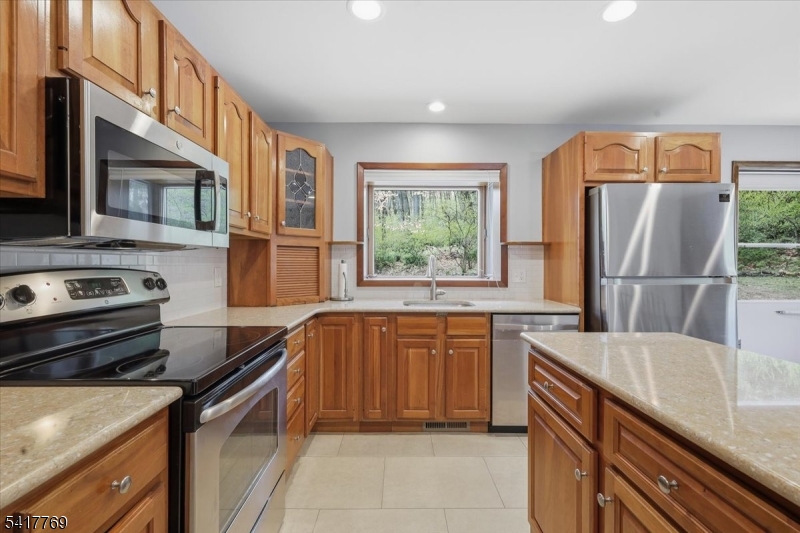9 Henderson Hill Road Hampton, NJ 08827 - Photo 9 of 36 a kitchen with stainless steel appliances granite countertop a refrigerator stove and sink
