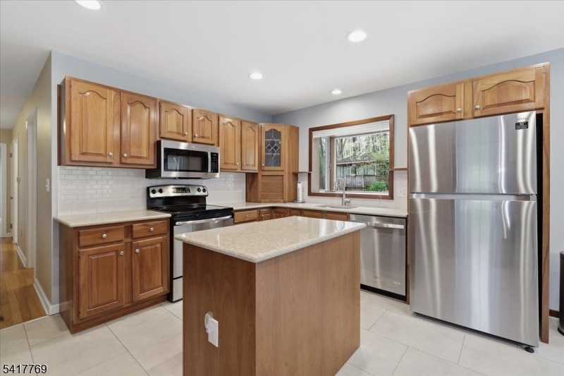 9 Henderson Hill Road Hampton, NJ 08827 - Photo 10 of 36 a kitchen with stainless steel appliances granite countertop a refrigerator stove microwave sink and cabinets