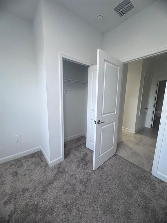 3071 Camden Way Davenport, FL 33837 - Photo 14 of 44 an empty room with a door