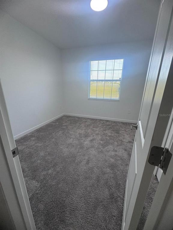 3071 Camden Way Davenport, FL 33837 - Photo 16 of 44 a view of an empty room and a window