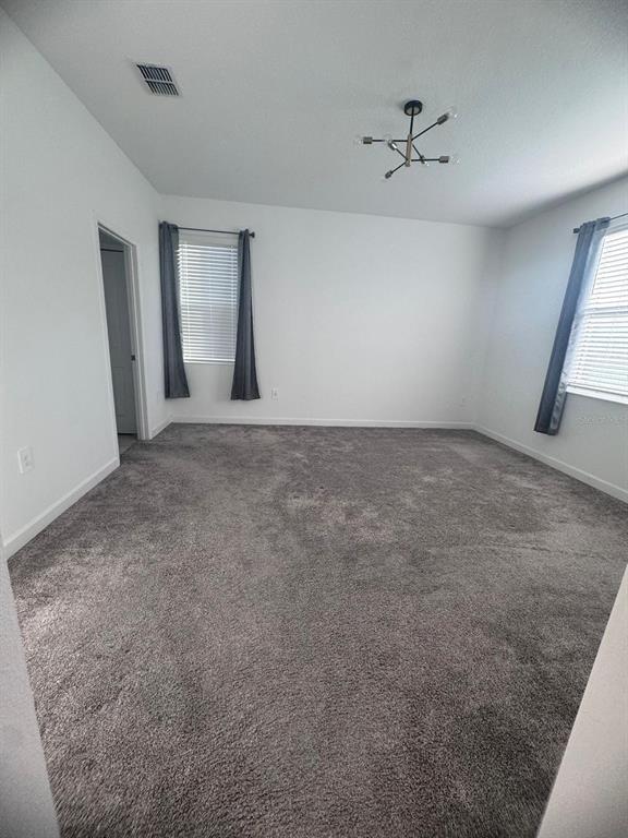 3071 Camden Way Davenport, FL 33837 - Photo 20 of 44 a view of an empty room with a window