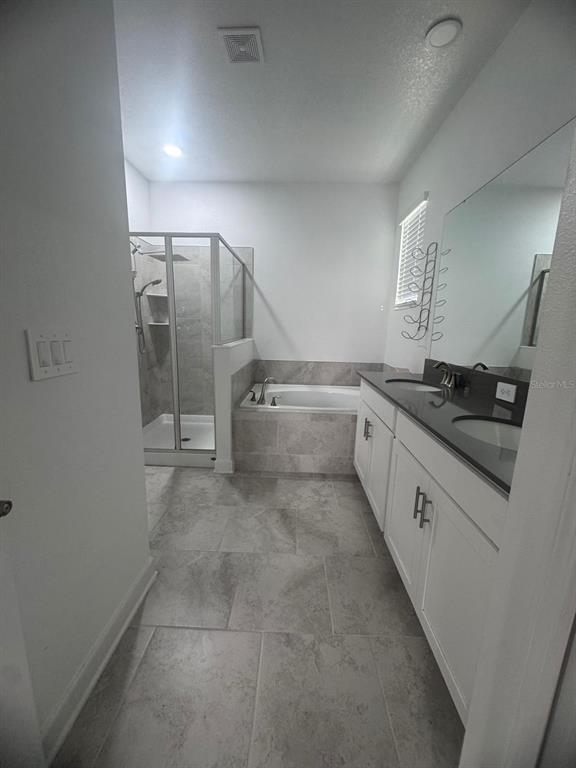3071 Camden Way Davenport, FL 33837 - Photo 23 of 44 a large white kitchen with a sink and cabinets