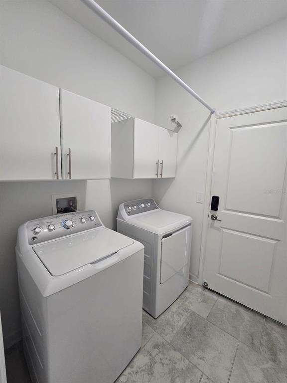 3071 Camden Way Davenport, FL 33837 - Photo 30 of 44 a utility room with dryer and washer