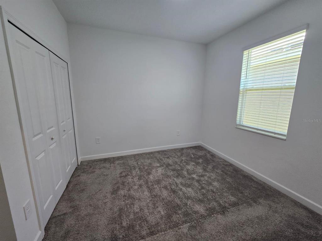 3071 Camden Way Davenport, FL 33837 - Photo 33 of 44 an empty room with a empty space and a window