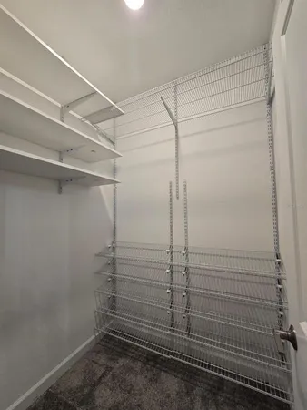 a bathroom with a tub a toilet and a shower