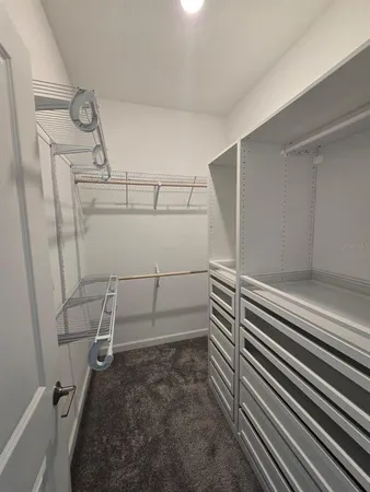 an empty room with closet area