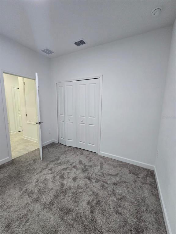3071 Camden Way Davenport, FL 33837 - Photo 40 of 44 an empty room with closet area