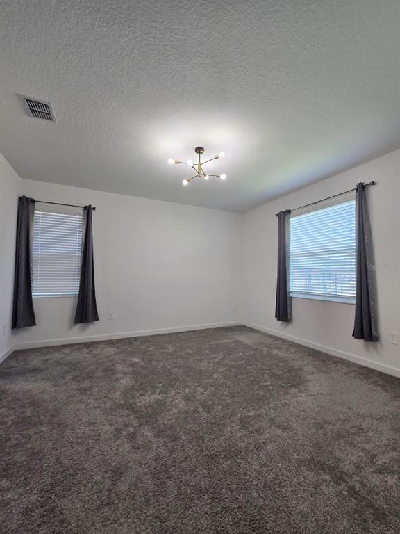 3071 Camden Way Davenport, FL 33837 - Photo 41 of 44 a view of an empty room with a window