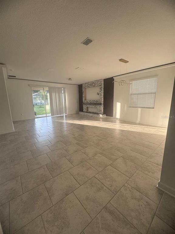 3071 Camden Way Davenport, FL 33837 - Photo 9 of 44 a view of empty room with wooden floor