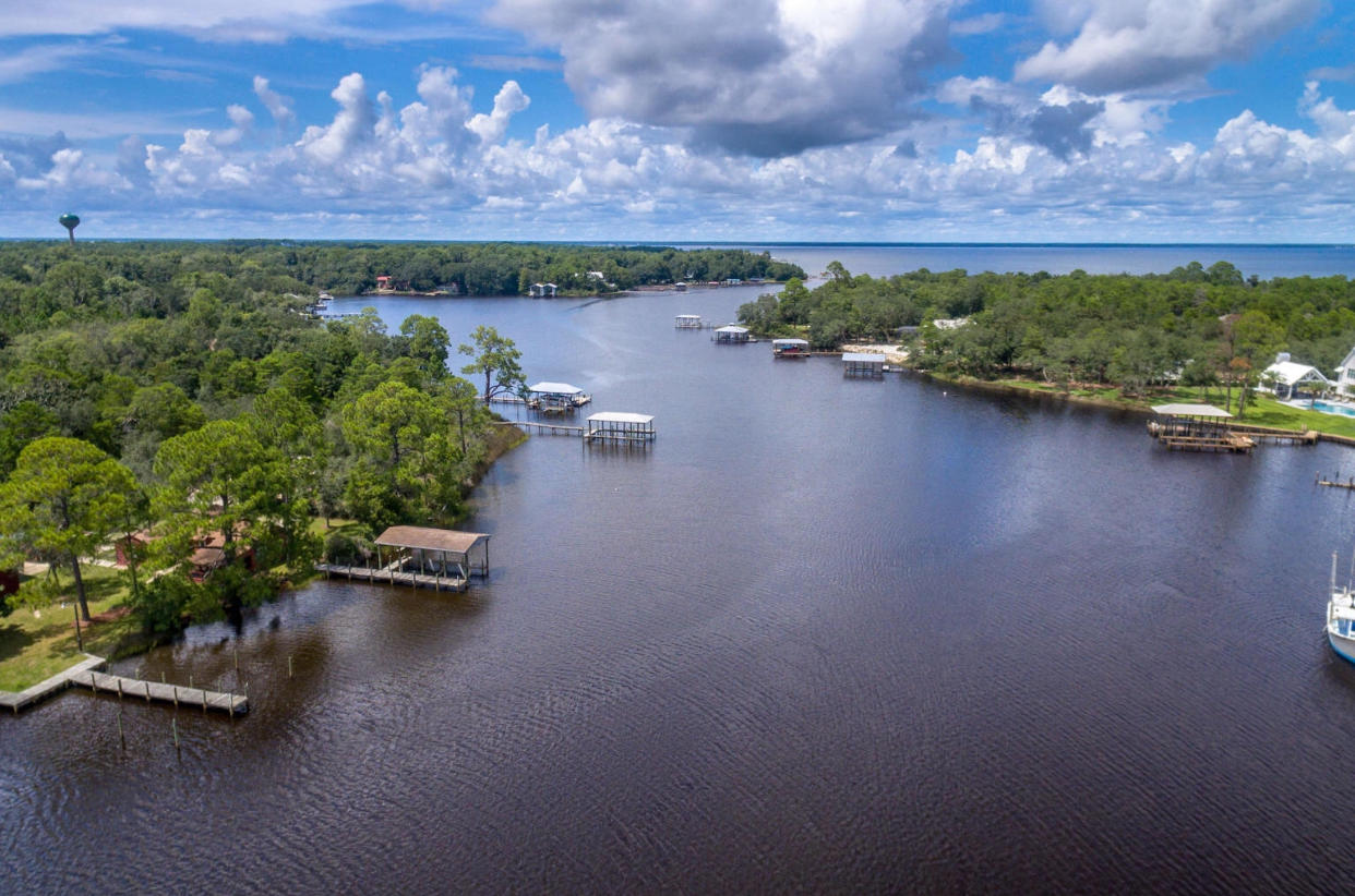 63 Bayou Road Santa Rosa Beach, FL 32459 - Photo 3 of 10 a view of a lake with a mountain