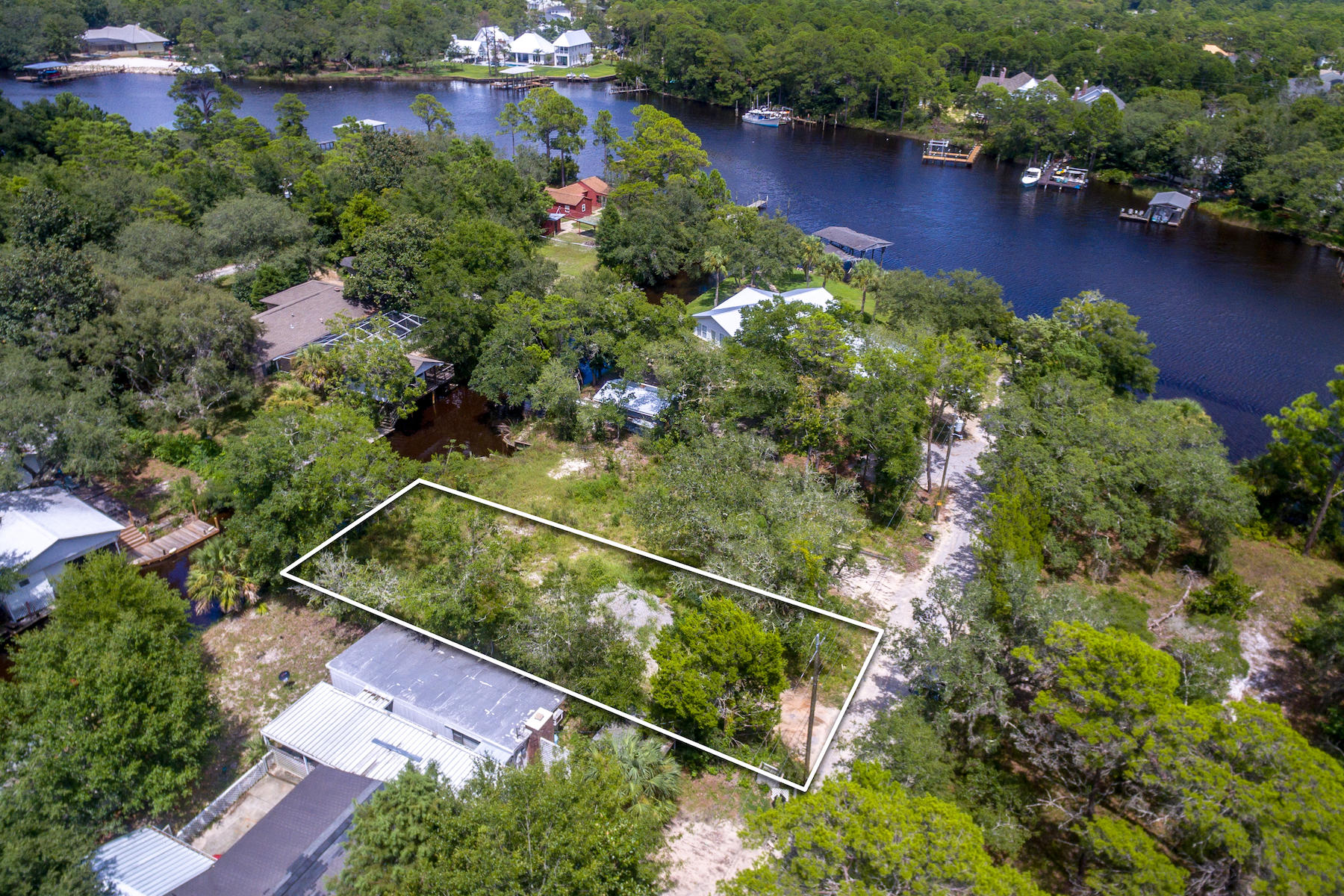 63 Bayou Road Santa Rosa Beach, FL 32459 - Photo 5 of 10 an aerial view of a house yard swimming pool and outdoor seating