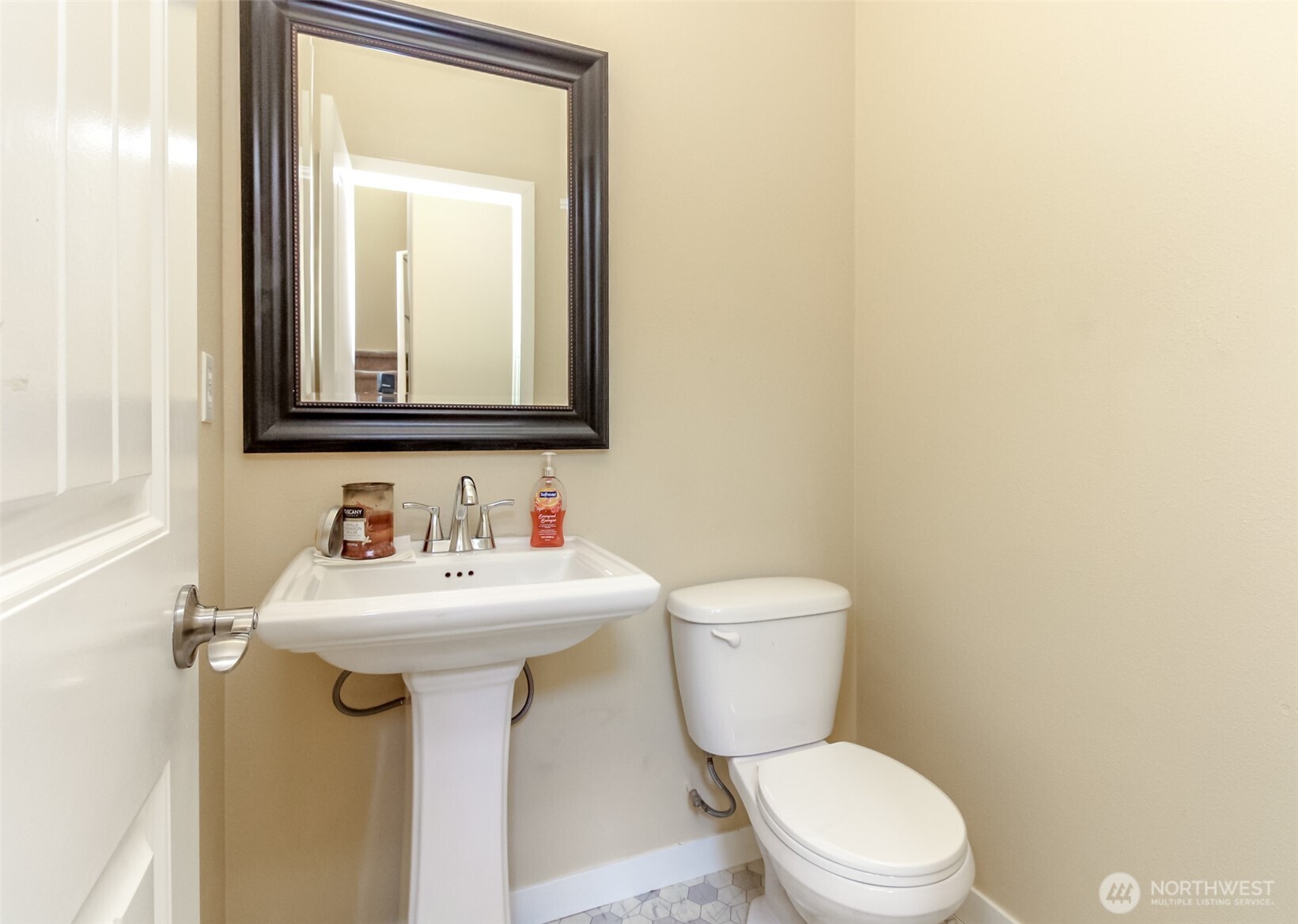 1605 Riddell Avenue Northeast Orting, WA 98360 - Photo 14 of 35 a bathroom with a toilet sink and mirror