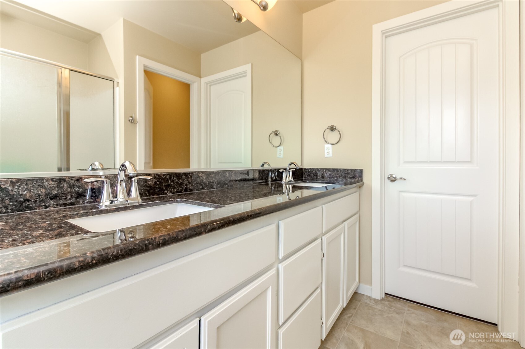 1605 Riddell Avenue Northeast Orting, WA 98360 - Photo 20 of 35 a bathroom with a sink and a mirror